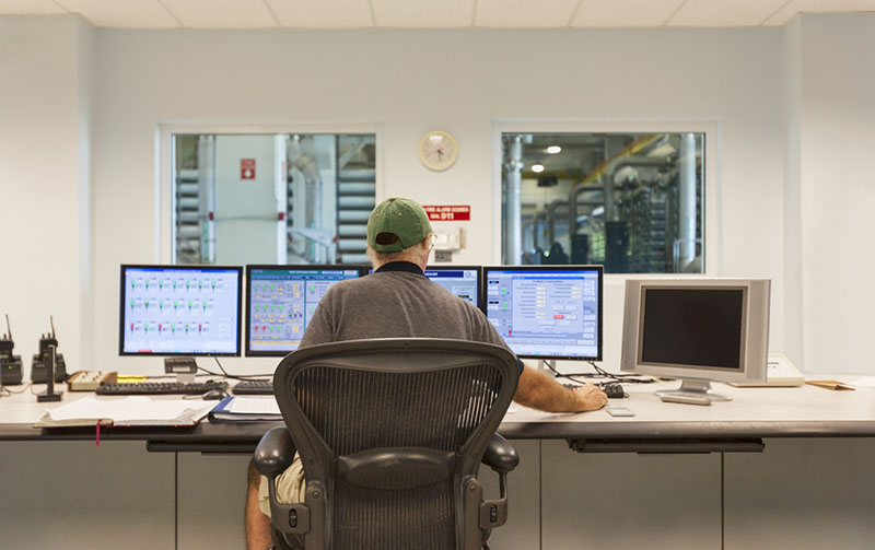 Interstate Chemical Company Technician working at the computer blending products.